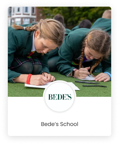 A graphics design of Bede School's logo with two female students writing on grass patch in the background