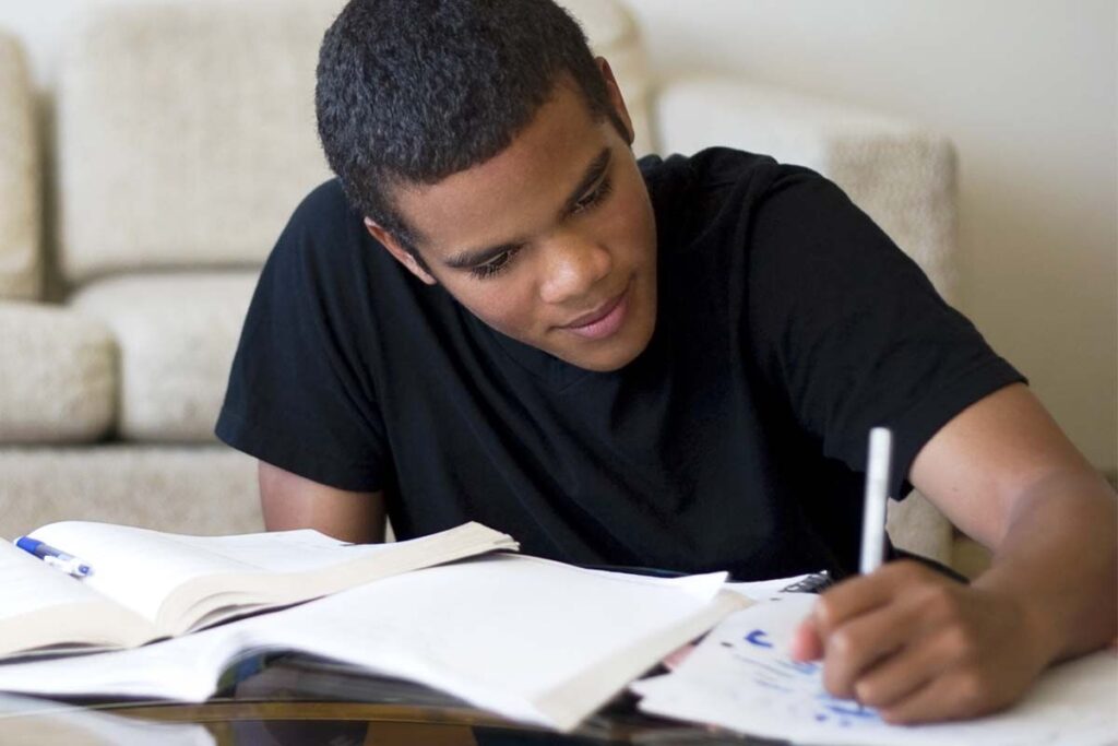 A teenage boy studying.